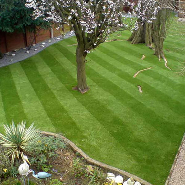 Muddy garden transformed with artificial grass- after